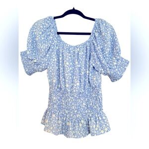 Woman’s light blue blouse short sleeves with elastic waist